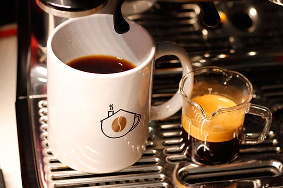 a short of espresso and a mug of coffee